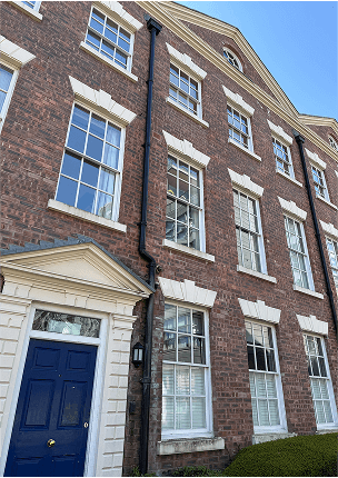 A picture of a Georgian property with sliding sash Georgian windows made and fitted by Preferred Joinery.